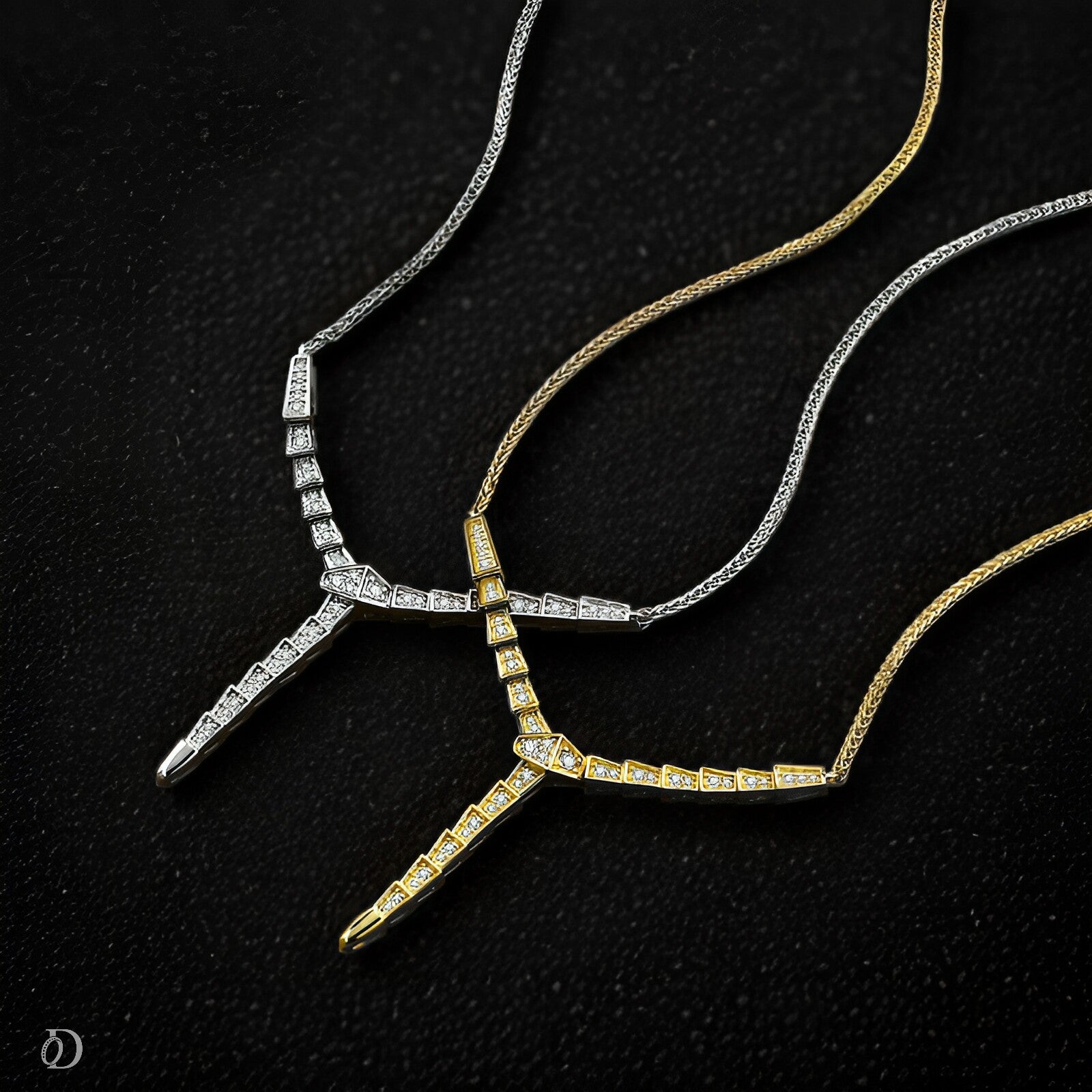 Two moissanite necklaces on a black background