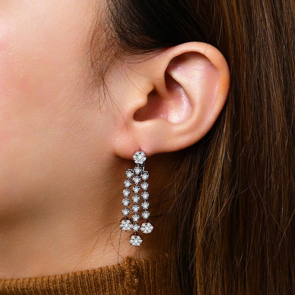 Close-up of an ear wearing a sparkling earring with a blurred background