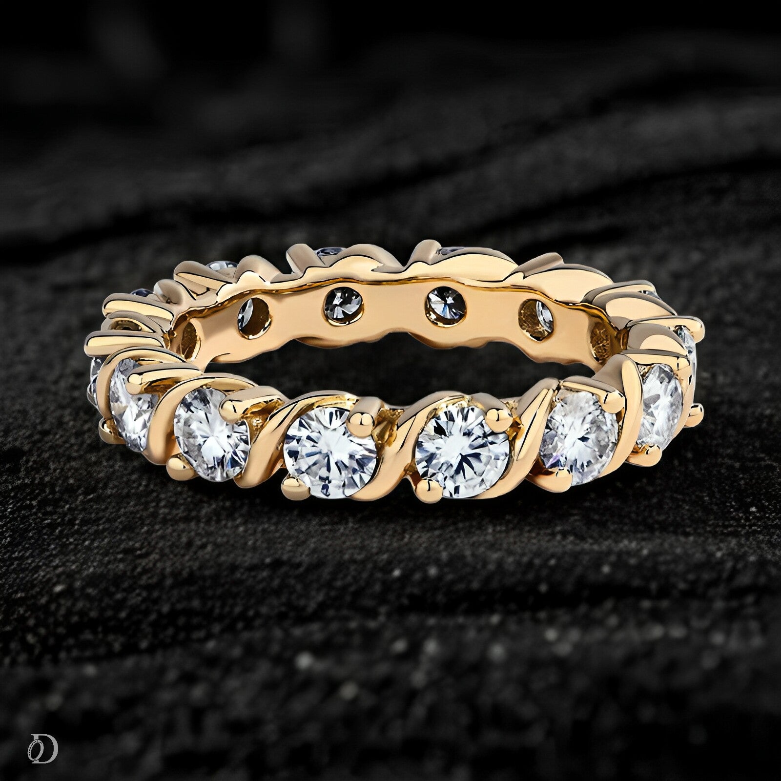 Gold ring with diamonds on a dark textured background