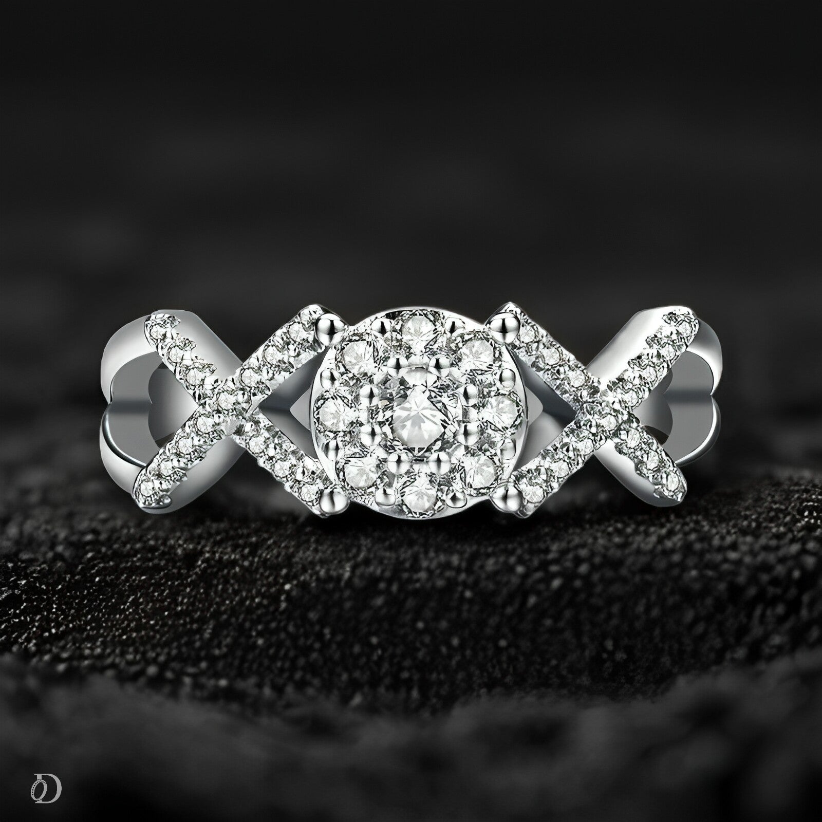 Silver ring with diamond accents on a textured black surface