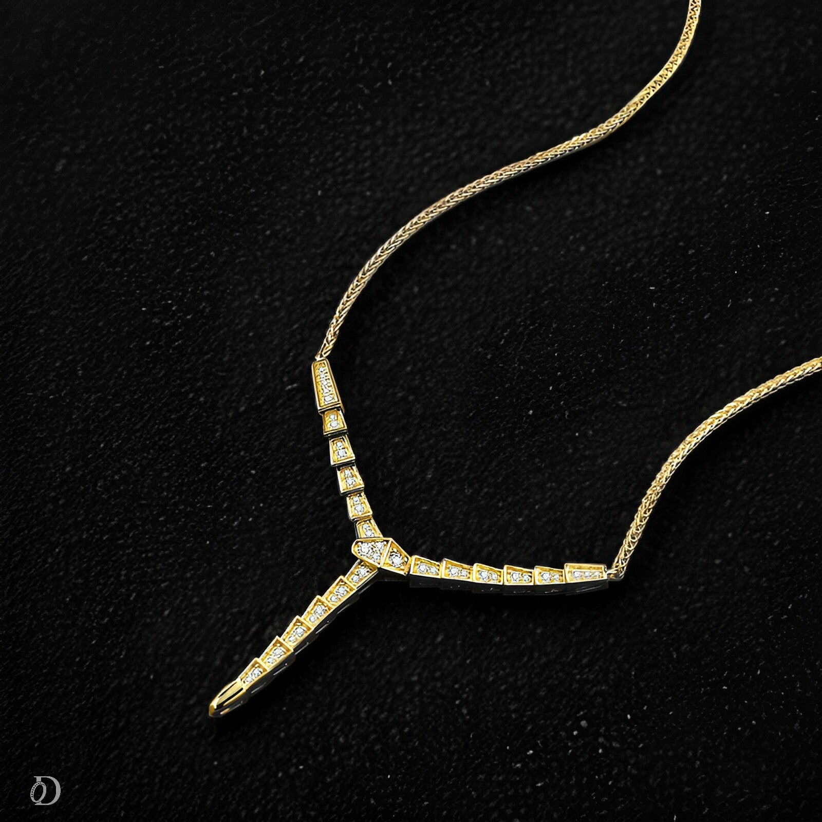 Gold necklace with a unique design on a black background