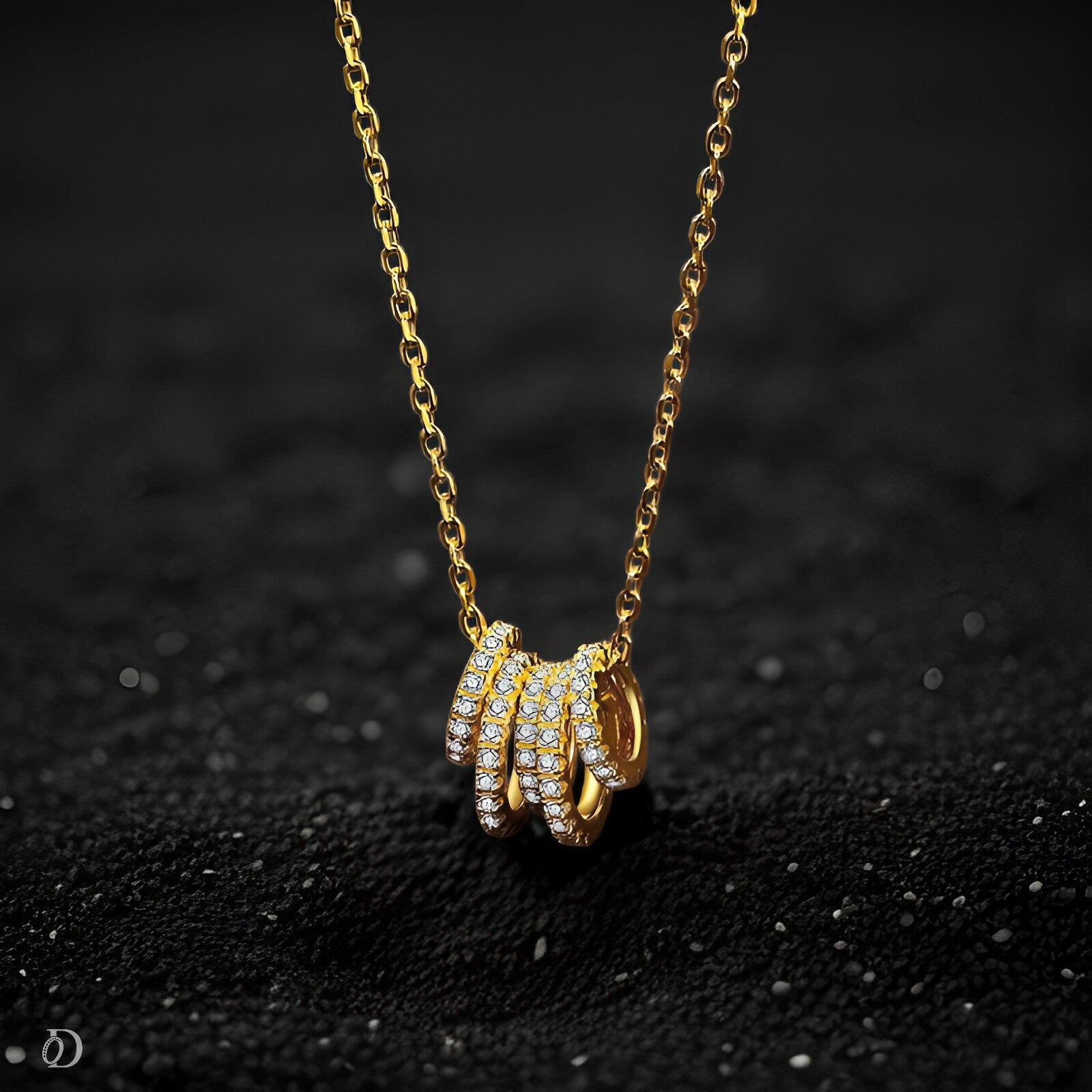 Gold necklace with a unique pendant on a dark textured background